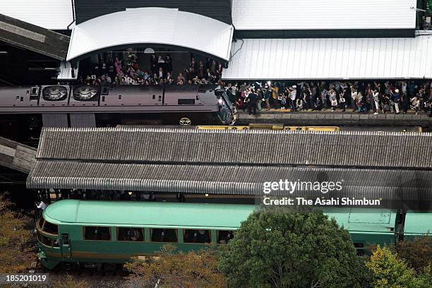 In this aerial image, JR Kyushu's luxury sleeper train 'Nanatsuboshi ' is approaching to the platform of Yufuin Station on October 15, 2013 in Yufu,...