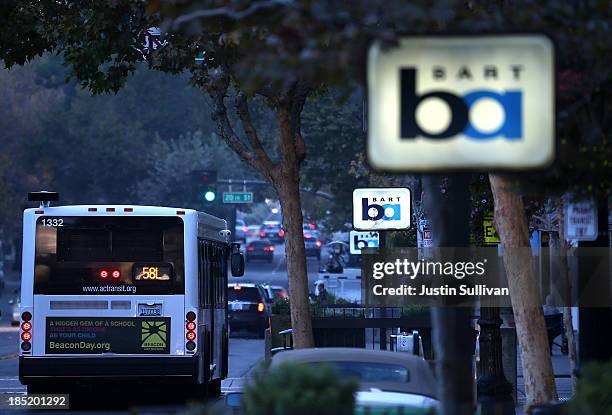 An AC Transit bus passes a Bay Area Rapid Transit station on the first day of the BART strike on October 18, 2013 in Oakland, California. For the...