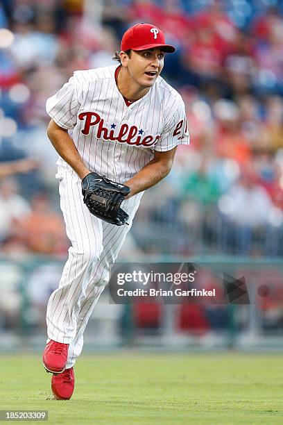 Starting pitcher John Lannan of the Philadelphia Phillies fields the ball during the game against the San Francisco Giants at Citizens Bank Park on...