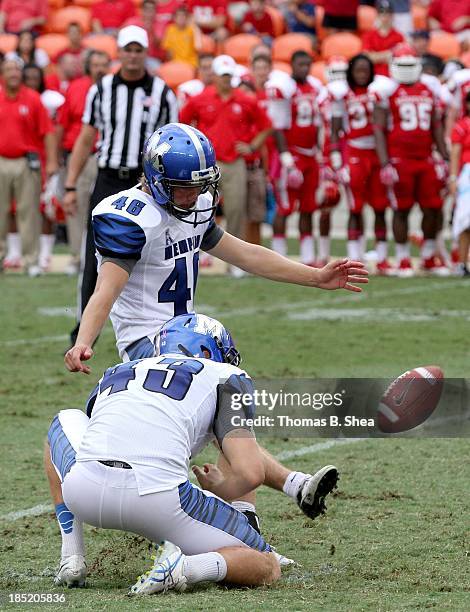 Kyle Wilson of the Memphis Tigers kicks a field goal against the Houston Cougars on October 12, 2013 at BBVA Compass Stadium in Houston, Texas....