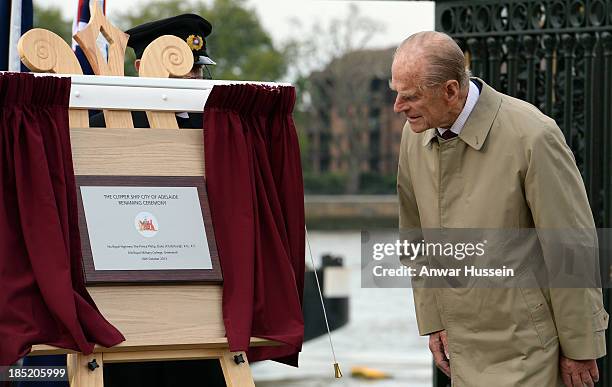 Prince Philip, Duke of Edinburgh unveils a plaque during the renaming ceremony for the clipper ship 'The City of Adelaide' on October 18, 2013 in...