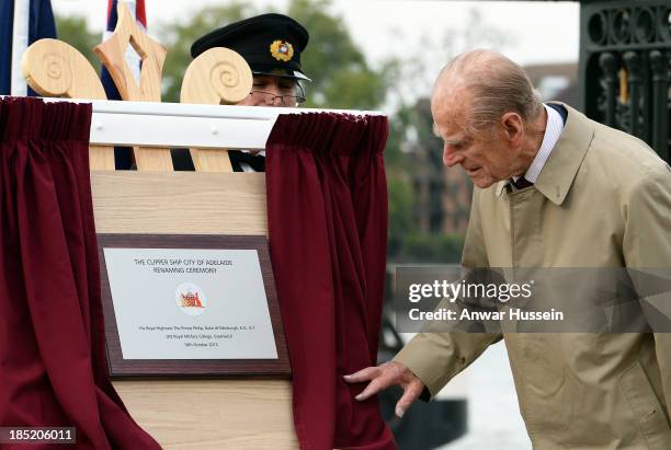 Prince Philip, Duke of Edinburgh unveils a plaque during the renaming ceremony for the clipper ship 'The City of Adelaide' on October 18, 2013 in...