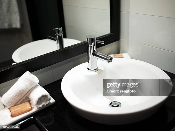 modern bathroom sink with mirror reflection - bathroom sink stock pictures, royalty-free photos & images