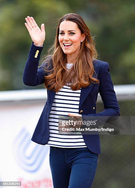 Catherine, Duchess of Cambridge waves as she leaves the Copper Box Arena in the Queen Elizabeth Olympic Park after attending a SportsAid Athlete...