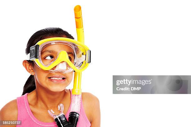 little girl wearing snorkel looking away at copyspace - scuba diving girl stock pictures, royalty-free photos & images