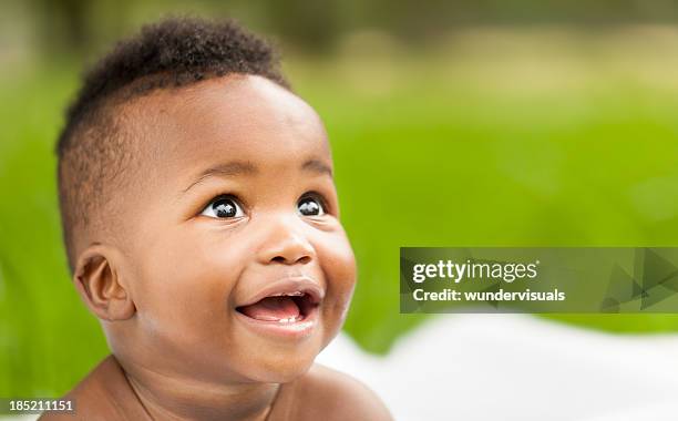 smiling little african american baby - black eye close up stock pictures, royalty-free photos & images