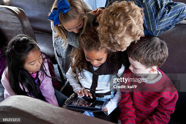 children sitting inside school bus with digital tablet - play bus stock pictures, royalty-free photos & images