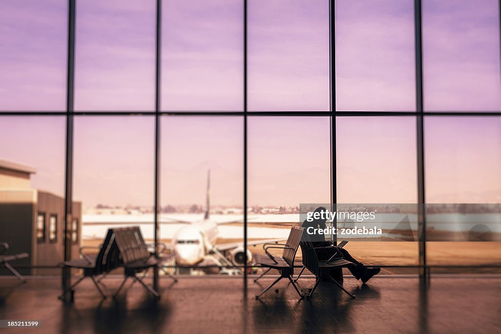 Man waiting for a flight at the airport