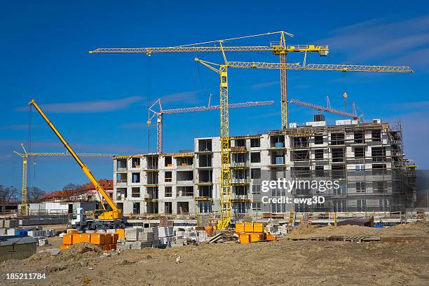new condominium building under construction - hoisting stock pictures, royalty-free photos & images