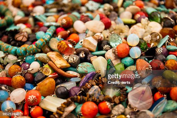 heap of colorful bright stone jewelry - bead necklace stock pictures, royalty-free photos & images