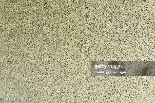 cladding stucco wall - pleister bouwmateriaal stockfoto's en -beelden