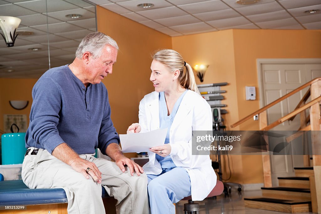 Physical therapist explaining treatment plan to patient