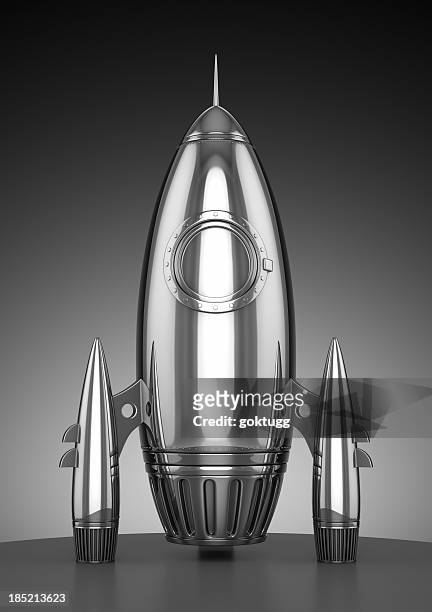 a uniquely shaped chrome rocket ship  - grey aliens stock pictures, royalty-free photos & images
