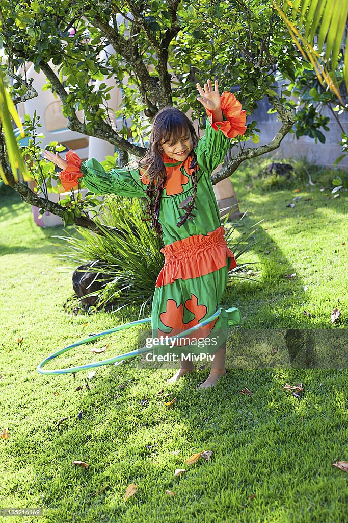 Hawaiian girl playing in the yard
