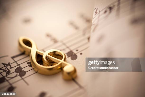 close up shot of music notes - treble clef stock pictures, royalty-free photos & images