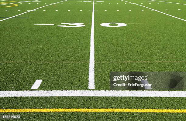 football field turf at 30 yard line - football sideline stock pictures, royalty-free photos & images