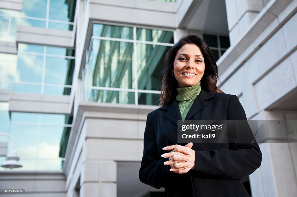 Businesswoman standing outside office building