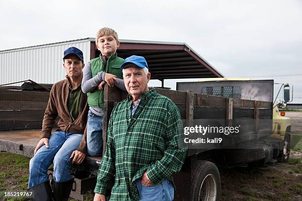 multi-generation family working on the farm - father son business bildbanksfoton och bilder
