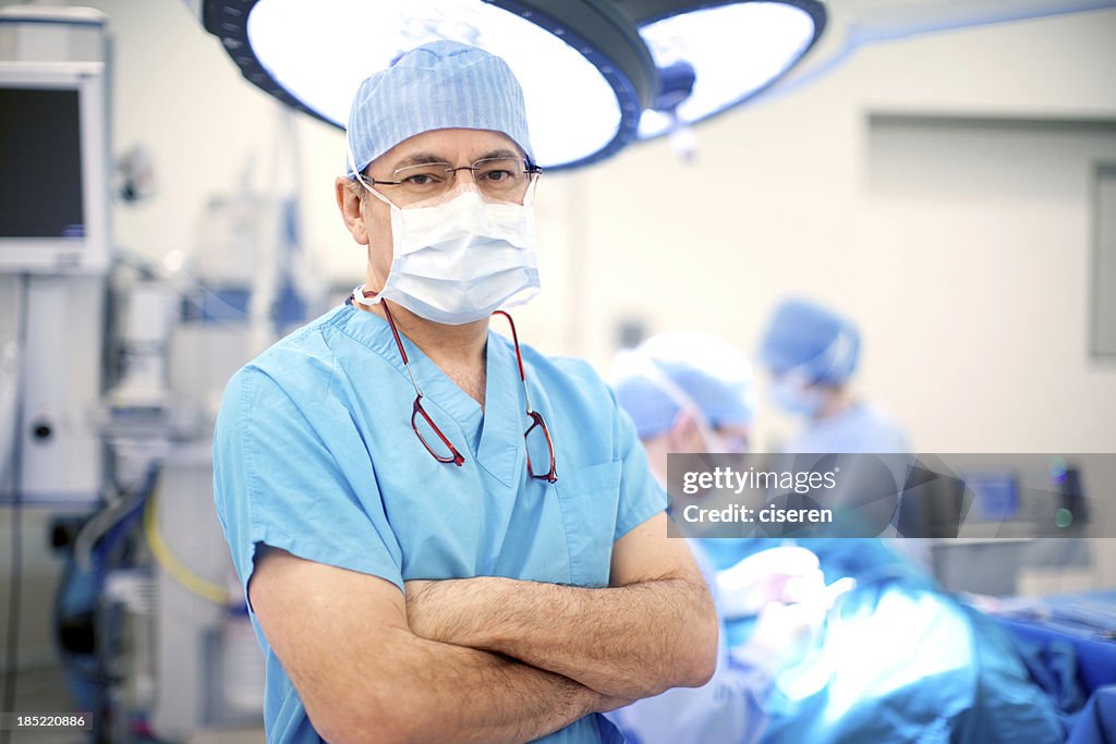 Doctor with surgical mask in operating room