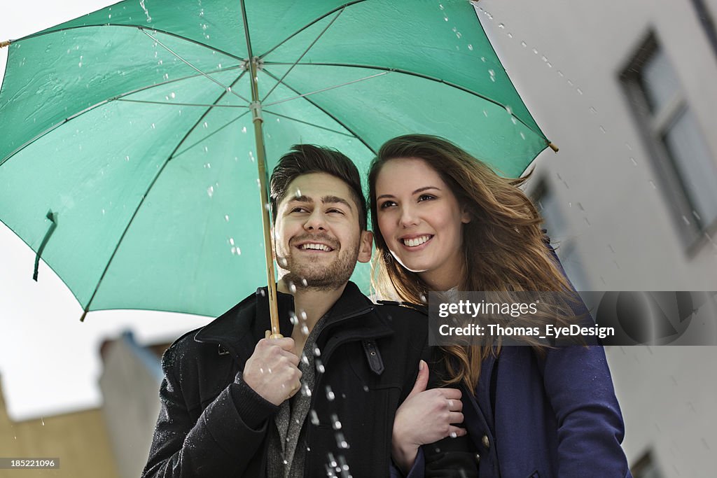 Happy Couple Walking in the Rain