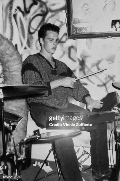 American actor Kevin Dillon playing the drums at The Limelight, a nightclub in New York City, New York, circa 1985.