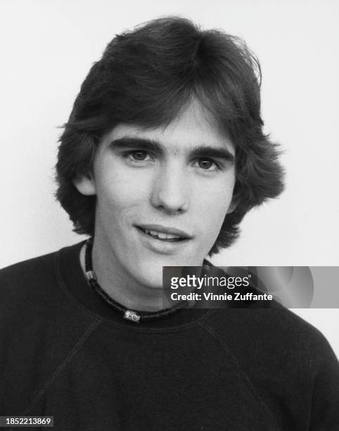 American actor Matt Dillon, wearing a dark crew neck t-shirt with a Native American choker-style necklace, United States, circa 1985.