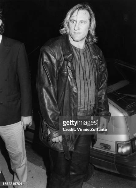 French actor Gerard Depardieu, wearing a striped sweater beneath a black leather jacket, attends a party at the French consulate on the Upper East...