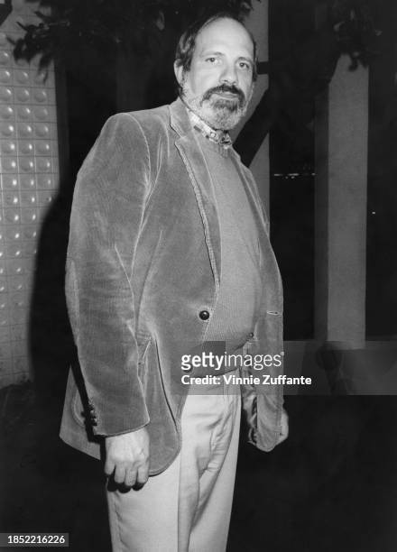 American film director and screenwriter Brian De Palma, wearing a corduroy jacket, a sweater and a checked shirt, attends a Directors Guild of...