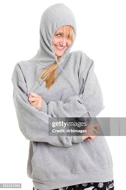 happy woman pulling on sweatshirt drawstrings - hood clothing stock pictures, royalty-free photos & images