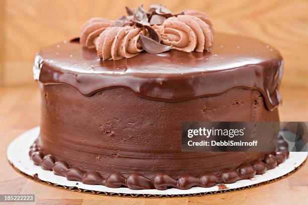 whole chocolate fudge cake - chocolate cake stock pictures, royalty-free photos & images