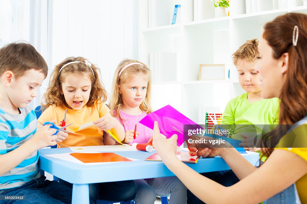 Preschool: Children Craft Activities with color paper and glue.