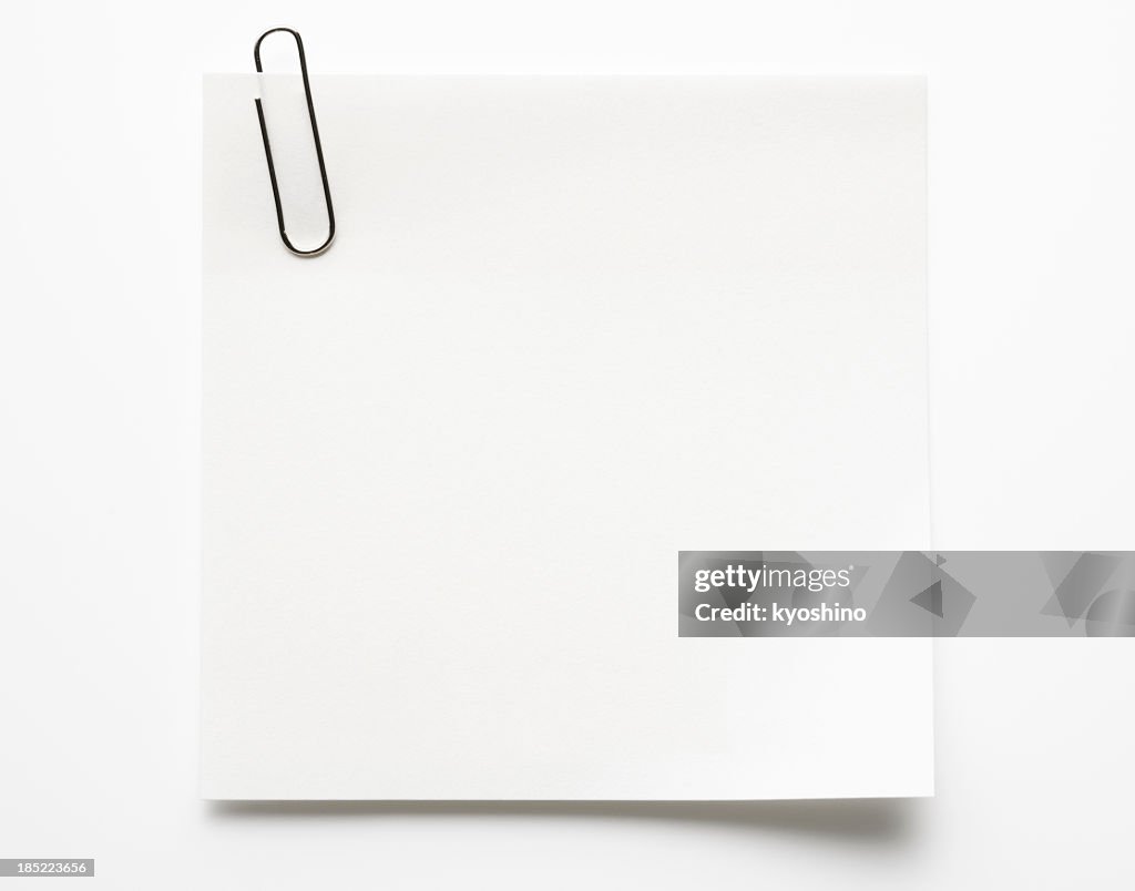 Blank white sticky note with paper clip on white background