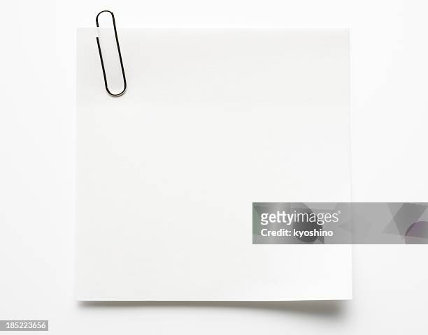 blank white sticky note with paper clip on white background - sticky note pad stock pictures, royalty-free photos & images