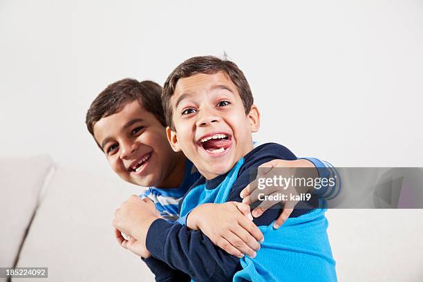 twin boys acting goofy - twin boys stock pictures, royalty-free photos & images