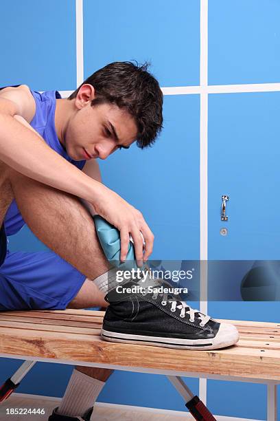 injured basketball player - high school locker room stock pictures, royalty-free photos & images