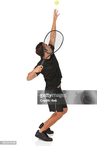 tennis player in action - man studio shot stock pictures, royalty-free photos & images