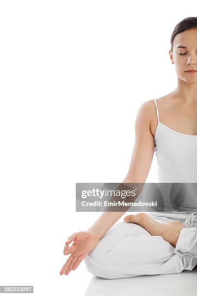 young woman exercising yoga - lotus position stock pictures, royalty-free photos & images