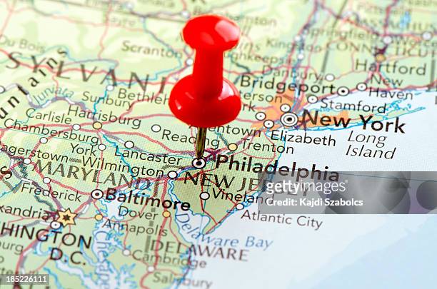 close-up of a philadelphia map with a pinpoint on it - philadelphia pennsylvania map stock pictures, royalty-free photos & images