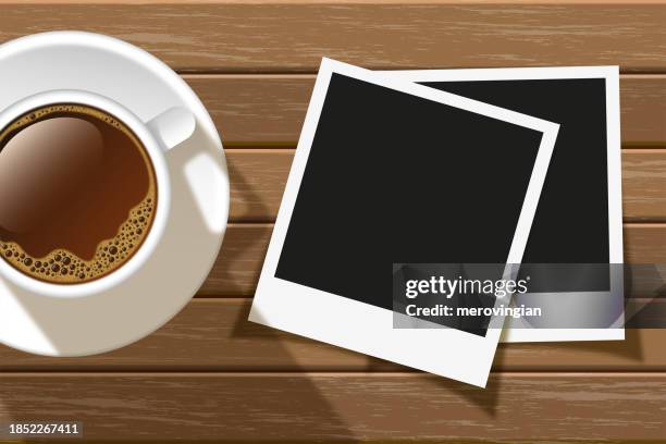coffee cup and two photo frames on wooden table - breakfast with view stock illustrations