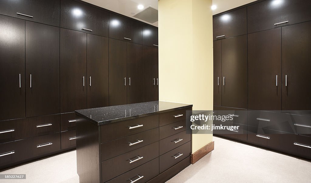 Modern Master Bedroom Closet With Dark Stain High-Res Stock Photo ...