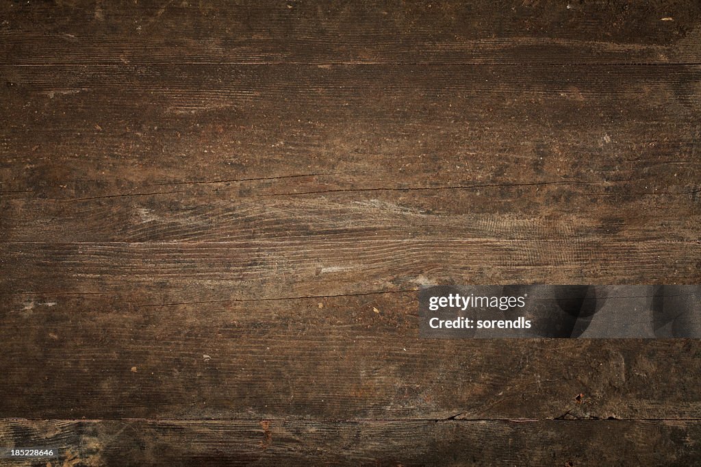 Overhead view of old dark brown wooden table