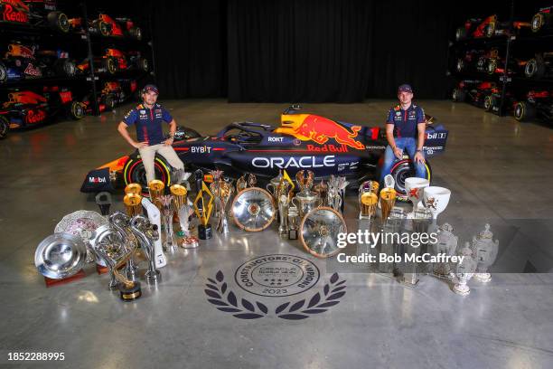 Sergio Perez of Mexico and Oracle Red Bull Racing and Max Verstappen of the Netherlands and Oracle Red Bull Racing pose for a photo with trophies...