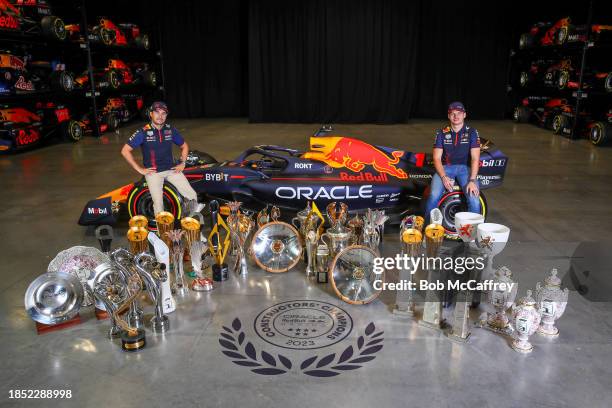 Sergio Perez of Mexico and Oracle Red Bull Racing and Max Verstappen of the Netherlands and Oracle Red Bull Racing pose for a photo with trophies...