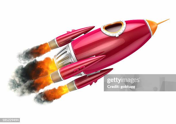red rocket flying on white background - raket stockfoto's en -beelden