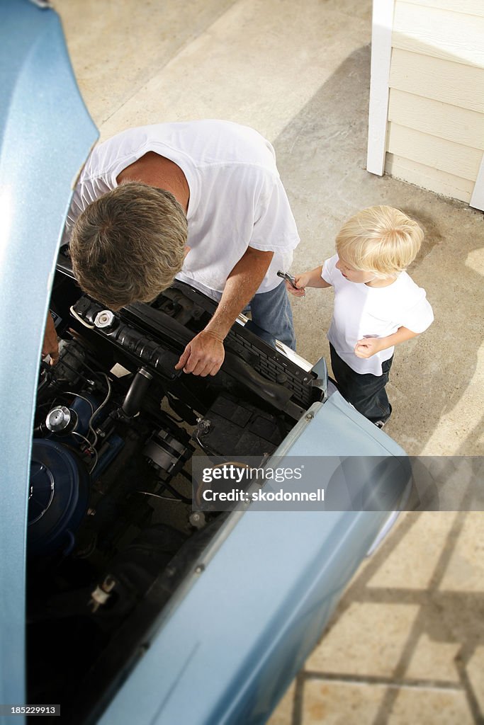 Father and Son Fixing the Car