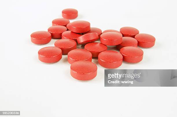 round red pills on white - ibuprofen 個照片及圖片檔