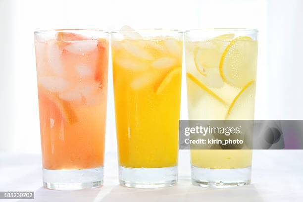citrus juices - fizzy lemonade stock pictures, royalty-free photos & images