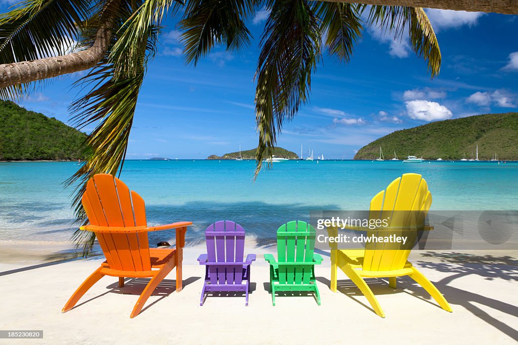 Andirondack chairs at a beach in the Caribbean
