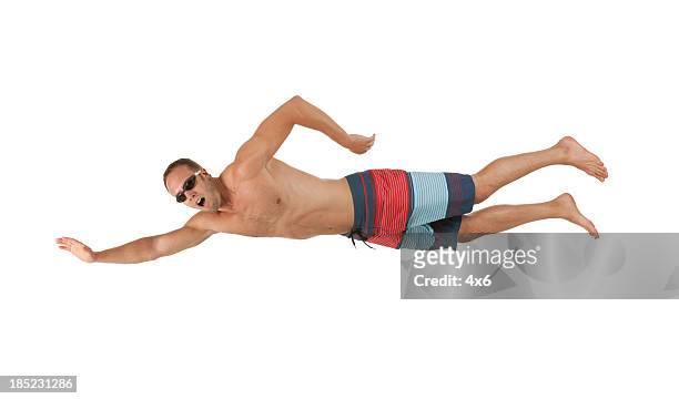 man swimming - zwembroek stockfoto's en -beelden