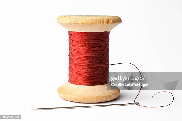 needle and red line - sewing needle stock pictures, royalty-free photos & images